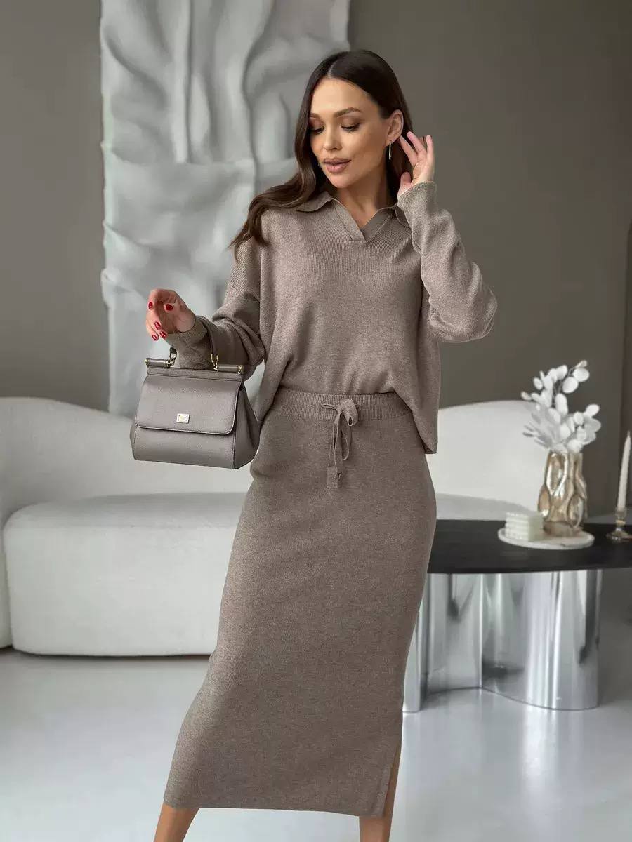 Knitted two-piece matching set with collared long sleeve top and drawstring midi skirt.